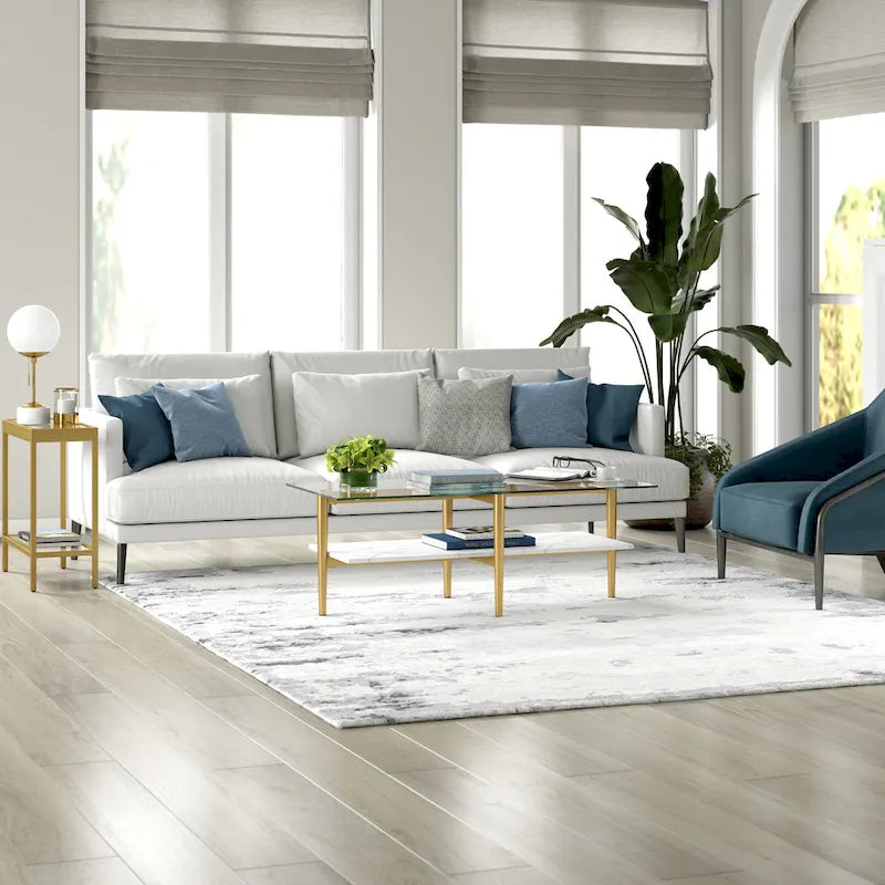 Table basse glamour mi-siècle, structure dorée et plateau en verre